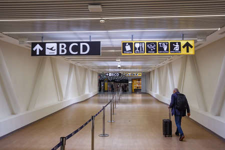 Unidentified passenger walks to the boarding gates in airportのeditorial素材