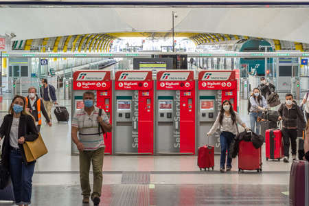 Unidentified passenger with medicine masks walks to departure terminal 3 in Rome Fiumicino Airport, Rome, Italyのeditorial素材