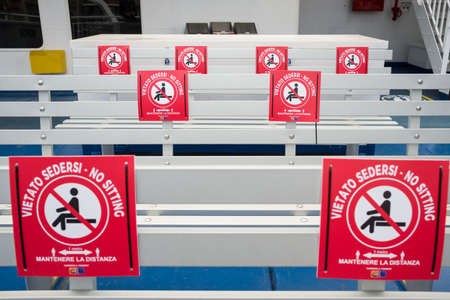 Public transportation during the coronavirus pandemic Covid 19. Ferry between Sicily and mainland in Italyのeditorial素材