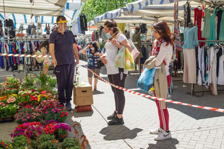 Outdoor weekly market in Linguaglossa town during Covid-19 pandemic in Italyのeditorial素材