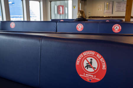 Public transportation during the coronavirus pandemic Covid 19. Ferry between Sicily and mainland in Italyのeditorial素材