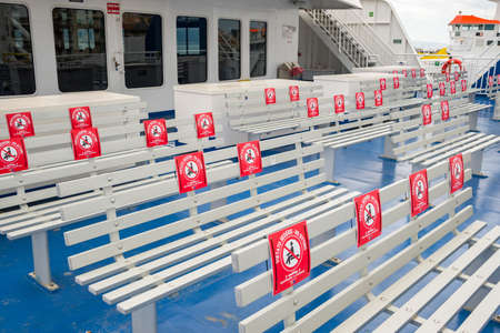 Public transportation during the coronavirus pandemic Covid 19. Ferry between Sicily and mainland in Italyのeditorial素材