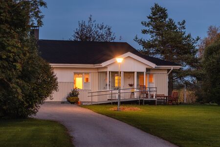 Typical Finnish style countryside house at night.の写真素材