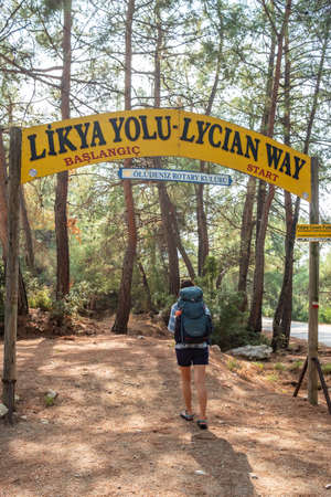 Young woman with backpack starts the Lycian way hiking trail in Turkey.のeditorial素材