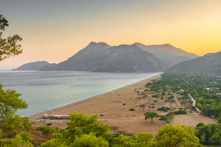 Beautiful sunset view of the Cirali Olympos beach at Mediterranean sea, Antalya, Turkeyの写真素材