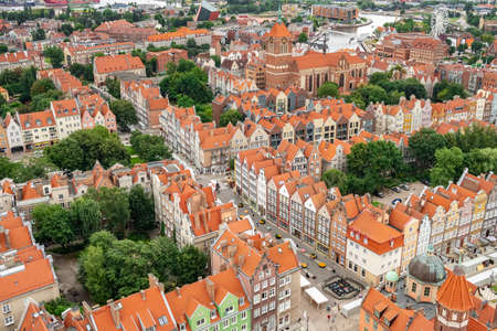 Top view of Gdansk old town with reddish tiled roofs of old town in Gdanskの写真素材