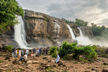 Unidentified Indian tourists visiting Athirappilly waterfalls in Kerala, Indiaのeditorial素材