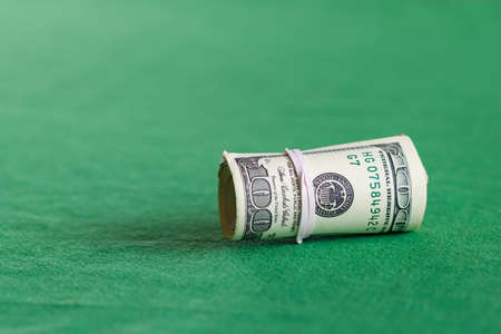 Roll of hundred USA dollar bills close upの写真素材