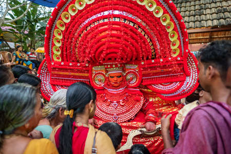 Theyyam artist perform during temple festival in Kannur, Kerala, India.のeditorial素材