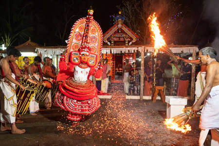 Theyyam artist perform during temple festival in Payyanur, Kerala, India.のeditorial素材