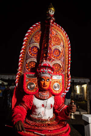 Theyyam artist perform during temple festival in Payyanur, Kerala, India.のeditorial素材