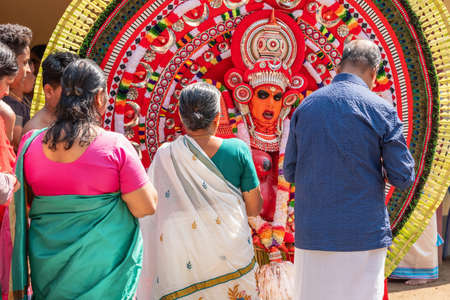 Theyyam artist perform during temple festival in Payyanur, Kerala, India.のeditorial素材