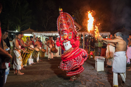 Theyyam artist perform during temple festival in Payyanur, Kerala, India.のeditorial素材