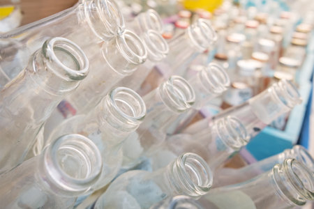 Empty glass bottles collected for recycling close-upの写真素材