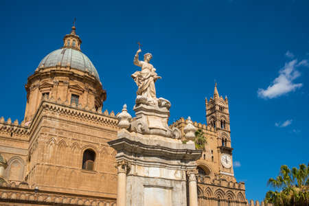 Sculpture in front of Palermo Cathedral church against blue sky, Sicilyの写真素材