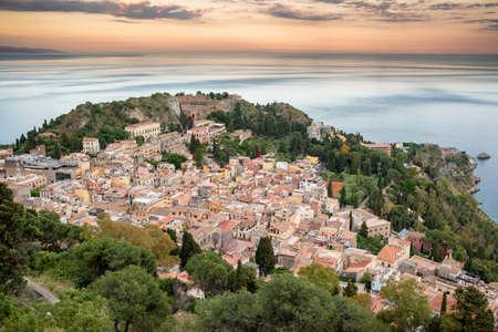 Picturesque Taormina town at sunset in Sicily, Italyの写真素材