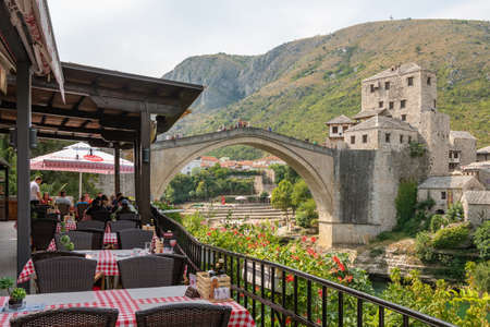 Outdoor restaurant with a view at Stari Most bridge in old town of Mostar, Bosnia and Herzegovinaのeditorial素材