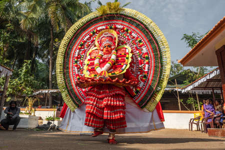 Theyyam artist perform during temple festival in Payyanur, Kerala, India.