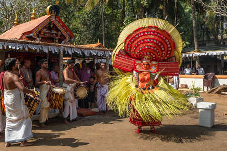 Theyyam artist perform during temple festival in Payyanur, Kerala, India.のeditorial素材
