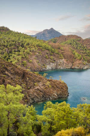 Beautiful lanscape of the Mediterranean sea coast with green pine trees and rocky mountains.の写真素材