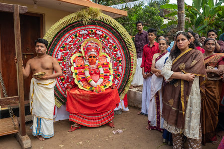Theyyam artist perform during temple festival in Payyanur, Kerala, India.のeditorial素材
