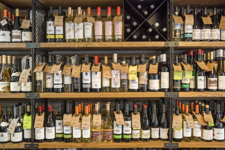 Variety of modern moldovan wine on the shelves in wine shop in Chisinau, Moldovaのeditorial素材