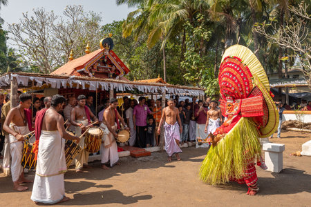 Theyyam artist perform during temple festival in Payyanur, Kerala, India.のeditorial素材