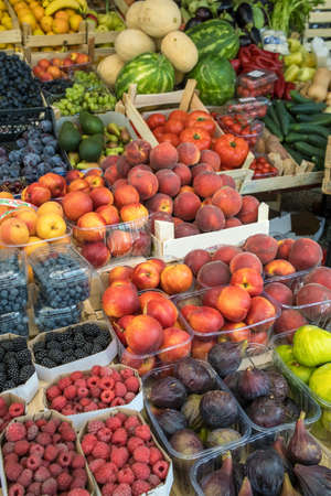 Market stall with fresh fruits and vegetablesの写真素材