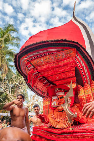 Theyyam artist perform during temple festival in Payyanur, Kerala, India.のeditorial素材