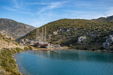 Vintage sailboats in a beautiful bay at Mediterranean sea in Turkeyの写真素材