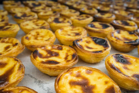 Traditional Portuguese dessert Pastle de Nata with custard on the counterの写真素材