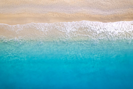 Aerial top down drone shot above an empty beach.の写真素材