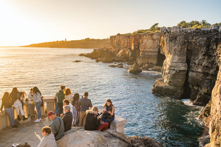 Natural landmark Boca do Inferno or Hells mouth in Cascais city at sunset, Portugalのeditorial素材