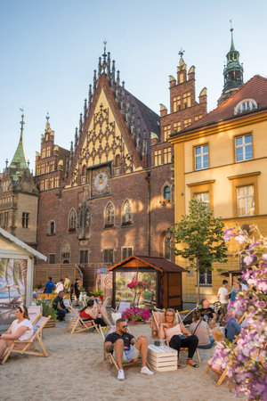 Unidentified people relax in chill out zone on Wroclaw rynek square in summer.のeditorial素材