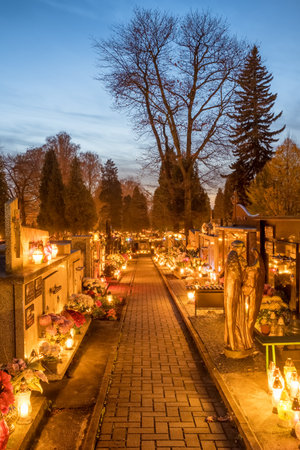 Candle lights at the cemetery at night in Poland during All Saints Dayのeditorial素材