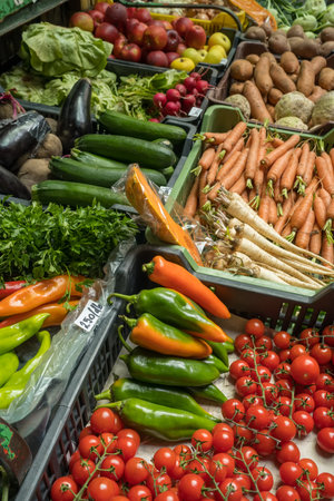 Variety of vegetables on the counter of vegetable market.の写真素材