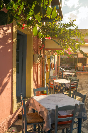 Cozy outdoor cafe in Fiskardo fishing village on Kefalonia island, Greeceの写真素材