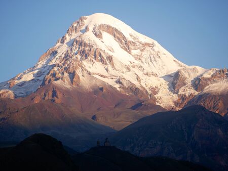 Monastery in Kazbek in georgian mountains in summer time