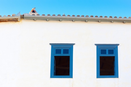 Traditional window frames in greek Island Hudra at saronikos gulfの写真素材
