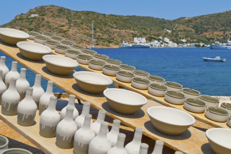 Greece Sifnos,Colorful sea view on the island in front of traditional utensilsの写真素材