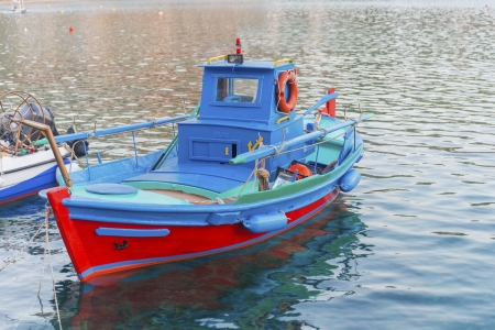 Greece Syros island, fishing boats at sea in a traditional Syros port in Cyclades