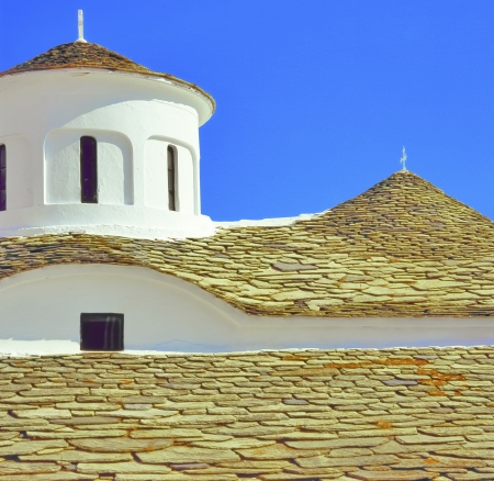 Greece traditional stone rooftop of church in greek island Skopelosの写真素材