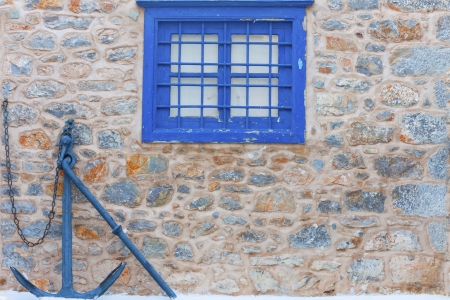 Window frame by Anchor in Greek island Hydra in Saronikos Gulfの写真素材