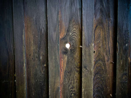 Wooden fence with spyholeの写真素材