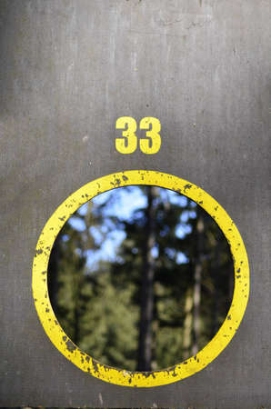 Board with a yellow circle and the number 33の写真素材