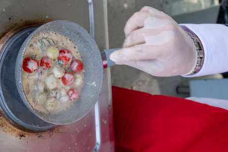 Chef in hotel or restaurant kitchen cooking only handsの写真素材