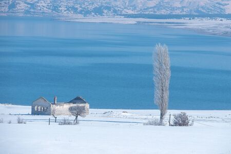 Winter Landcape with lake and villageの写真素材