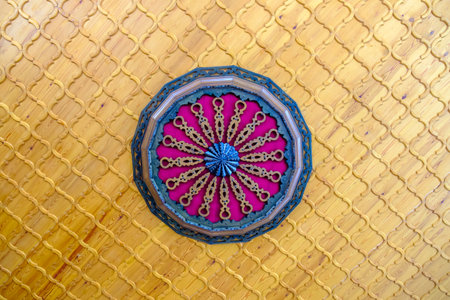 Details of wooden Wheel decoration on ceilingの写真素材