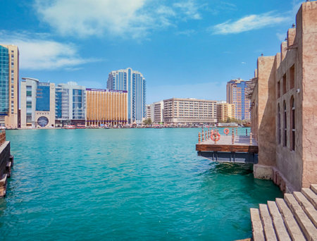 Dubai, United Arab Emirates. Dubai creek and boardwalk in Deira with the view of old Dubai in United Arab Emiratesの写真素材