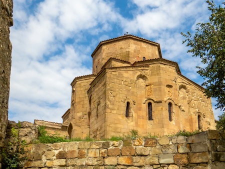 Beautiful nature and Jvari Monastery, Georgian Orthodox monastery of the 6th century on the mountain hill ove the old town of Mtskheta (UNESCO World Heritage site)の写真素材